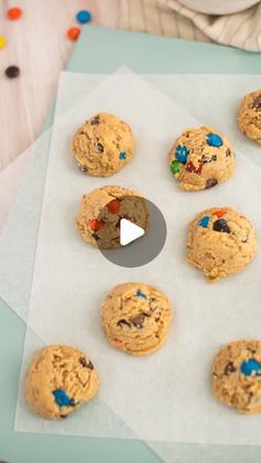 chocolate chip cookies are arranged on a piece of parchment paper