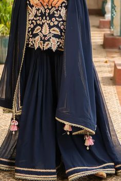 Navy blue kurta with all over floral embroidery. Paired with a gharara and dupatta. - Aza Fashions Blue Georgette Sharara With Dabka Detail, Blue Georgette Sharara With Dabka Embroidery, Fitted Blue Sharara With Dabka Detail, Elegant Blue Georgette Sharara, Blue Floor-length Georgette Sharara, Floor-length Blue Georgette Sharara, Blue Sharara With Dabka In Traditional Drape, Blue Sharara With Dabka For Navratri, Blue Dabka Sharara For Navratri