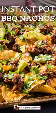 a tray filled with nachos covered in meat and cheese