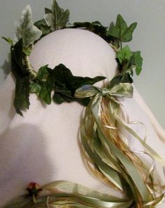 Faux  ivy leaves with coordinating ribbons, two with tiny gold colored rosebuds at the ends. This wreath is an especially versatile style for weddings, fairs, concerts, parties, plays, and many other different events and outfits. Please note that you are ordering a wreath that will be made to order, this allows me to make a custom designed wreath for you, you can have your wreath made to look just like the wreath in the picture, or you can have changes made to better reflect the colors and style of your event or outfit. If you choose to have changes made that involve adding or omitting certain colors of flowers, and/or ribbons, there would be no additional charge, the only time there may be an additional charge, would be if you wanted items that were not on the original design, shown in th Faux Ivy, Bridesmaid Crown, Floral Crown Wedding, Prom Decor, Ivy Leaves, Flower Girl Crown, Head Wreath, Christmas Rose, Flower Crown Wedding