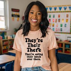 a woman wearing a t - shirt that says, they're there they're eating then lunch over that