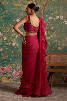 Deep fuchsia ruffle pre-draped saree. Paired with a padded blouse with emerald stone embroidery on the neckline. - Aza Fashions Saree Chiffon, Ridhi Mehra, Ruffle Saree, Drape Saree, Aza Fashion, Sleeveless Blouse, Skirt Length, Types Of Sleeves, Blouses For Women