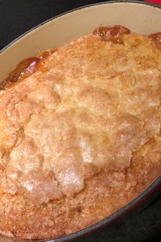 an apple cobbler in a pan on top of a stove