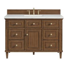 an image of a bathroom vanity with marble counter top and wooden cabinetry on white background