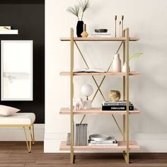 a shelf with books, vases and other items on it in a living room