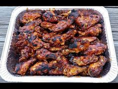 chicken wings in a tin on a wooden table