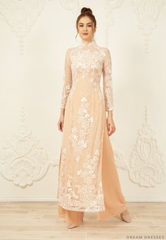 Custom made dusty pink Ao Dai Materials: lace, tulle, chiffon Collar: 1.8in/4.5cm tall collar Long sleeves Closure: zipper Chiffon pants Made to measure Champagne Ao Dai, Beige Wedding Dress With Intricate Embroidery, Wedding Ao Dai With Intricate Embroidery, Elegant Ao Dai With Intricate Embroidery For Ceremony, Elegant Ao Dai With Floral Embroidery For Festive Season, Intricate Embroidery Ao Dai For Wedding, Elegant Wedding Ao Dai With Intricate Embroidery, Traditional Lace Maxi Dress For Wedding, Festive Wedding Ao Dai With Floral Embroidery