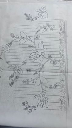 a piece of paper with flowers and lines drawn on the bottom, in black ink