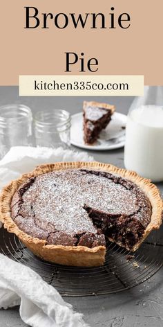 a chocolate brownie pie on a wire rack with a slice missing from the pie