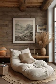 a large bean bag chair sitting on top of a rug in front of a window