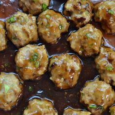 meatballs with sauce and green onions in a bowl