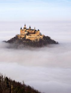 a castle in the middle of some clouds