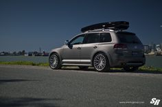 a grey car parked on the side of the road