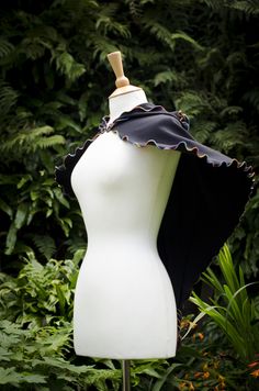 ~ Dark Luna Capelet ~ The Dark Luna Capelet is a perfect addition every Witches wardrobe. It's custom made to your size and colour specifications. Made using soft and stretchy 100% cotton jersey material, with wibbley thread detail in your choice of colour. The original was made in black jersey with rainbow thread. COLOURS ~ If none of the colours offered tickles your fancy, please let me know of your favorite colours & I will see if I can find the perfect colour fabric for you. CUSTOM ~ If Witchy Black Cape For Costume, Black Witchy Cape For Costume, Witchy Black Cape For Halloween, Black Fitted Capelet, Fitted Black Capelet, Witch Samhain, Rainbow Witch, Random Clothing, Purple Cape