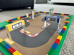 a lego race track is shown on the floor