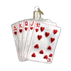 an ornament shaped like a playing card with hearts on the front and back