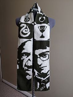 a scarf with an image of a man's face is hanging on a mannequin