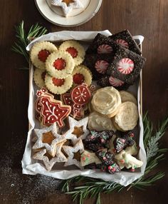 an assortment of cookies and pastries in a box