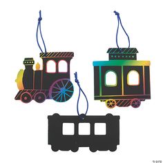 two colorful train ornaments hanging from strings