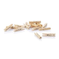 several wooden clothes pegs on a white background