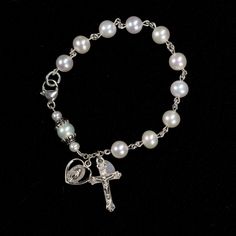 This dainty pocket rosary has been handmade with White Freshwater Pearls. I turned it into a bracelet so its easy to wear and keep with you for prayers. The Hail Mary's are White Freshwater Pearls. The Our Father is a White Pearl, encased with Sterling Silver bead caps, tipped with White Pearl rondelles. It's currently a 7in bracelet, I can make it bigger though, please just let me know your wrist size when purchasing. **This Pearl Bracelet Rosary can easily be customized with your favorite ston Bracelet Rosary, Custom Rosary, Pocket Rosary, Jewellery Photography Inspiration, Catholic Women, Girls Unique, Our Father, Freshwater Pearl Bracelet, White Freshwater Pearl