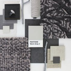 various carpet samples are arranged on top of each other, including one for the floor and two for the wall