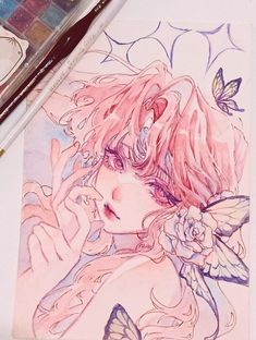 a drawing of a girl with pink hair and butterfly wings on her shoulder, next to some watercolor pencils