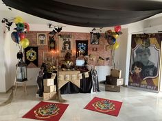 a room filled with harry potter decorations and balloons