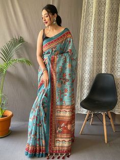 Delightfully produced from pure malai cotton, this sky-blue saree with a classic contrast blouse is a must-have addition to your ethnic wear collection. The vibrant kalamkari prints on the saree add a touch of excitement and uniqueness, making it stand out from the crowd.
The intricate detailing of the print, combined with the serene sky-blue hue, gives this saree a timeless aesthetic appeal. It exudes elegance and sophistication, perfect for any occasion. The ensemble is reminiscent of clear su Kalamkari Prints, Tassels Blouse, Royal Blue Saree, Sky Blue Saree, Kalamkari Print, Kalamkari Designs, Kalamkari Blouse, Kantha Sarees, South Silk Sarees