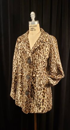 This wonderful vintage faux fur jacket is in great condition! This sweet little jacket is ready for that special someone. Another incredible vintage piece for your viewing! This coat was tag that reads - Made in U.S.A. Self: 60% Rayon 40% Cotton Lining: 100% Acetate With exclusive trim DRY CLEAN ONLY Coat measures ~ Shoulders 16ish inches, Raglan Sleeve 25ish, Chest 38 inches and length is 28 inches. Buyer to pay all related shipping costs plus insurance. Questions are welcome. All sales final. Vintage Faux Fur Outerwear With Long Sleeves, Vintage Faux Fur Long Sleeve Outerwear, Vintage Long Sleeve Faux Fur Outerwear, Retro Faux Fur Outerwear For Fall, Fitted Retro Fur Coat For Fall, Vintage Leopard Print Winter Outerwear, Vintage Leopard Print Outerwear For Winter, Vintage Long Sleeve Leopard Print Outerwear, Best Uniforms