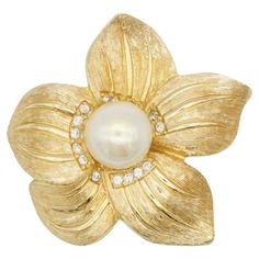 Christian Dior 1980s Vintage Wavy Flower White Circle Pearl Crystals Elegant Brooch, Gold Tone Very excellent condition and very new. 100% Genuine. A unique piece. This is gold plated stylised brooch. Safety-catch pin closure. Size: 4.0 cm x 4.0 cm. Weight: 17.0 g. _ _ _ Great for everyday wear. Come with velvet pouch and beautiful package. Makes the perfect gift for Teens, Sisters, Friends, Girlfriends, Birthdays, Anniversaries, Mother’s Day, Valentine’s Day, Christmas and many more. With exquisite fine detail, these fashion jewellery are ideal for a glamorous look. Ideal for a splendid gift or an eye-catching jewellery for your everyday outfit. Also don't forget to look through my other listings, I have so many more beautiful jewellery waiting for you. _ _ _ I am a freelancer more than 2 White Circle, Flower White, Crystal Brooch, Velvet Pouch, Everyday Outfit, 1980s Vintage, Fashion Jewellery, Vintage Jewellery, White Pearl