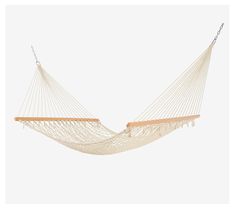 Experience the ultimate relaxation with this rope hammock that's perfect for lounging outdoors. Its traditional design features a high-density weave for unparalleled comfort, supported by sturdy hardwood spreader bars. This hammock is ideal for stretching out alone or sharing a peaceful moment with someone special, easily accommodating two people. From Castaway Living. Rope Hammock, Spreader Bar, Cotton Rope, Traditional Design, Hammock, Stretching, Density, Design Features, Outdoor Living