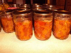 several jars filled with food sitting on top of a counter