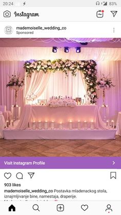 an instagram page with candles on the table and flowers in vases at the top