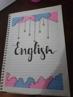 an open notebook with the word english written in cursive writing on top of it