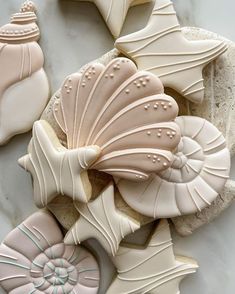 some cookies are laying on top of each other in the shape of seashells