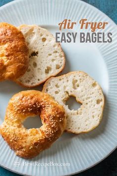 two bagels on a plate with the words air fryer easy bagsel above them