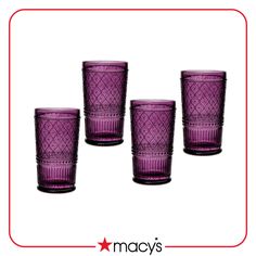 four purple glass tumblers sitting next to each other