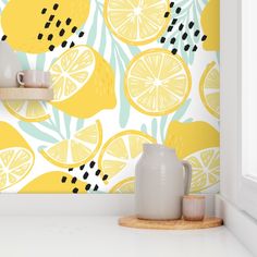 a wall with lemons and leaves painted on it