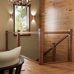 the interior of a house with wood paneling and chandelier