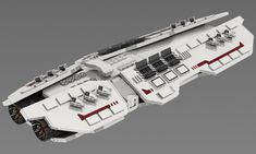 a white and red model of a space ship with lots of furniture on the deck