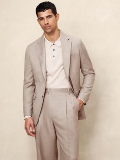 This timeless suit jacket is cut from an Italian wool fabric we love for its subtle twill texture.  Designed to carry you through all seasons, this beautiful fabric is woven in a Super 120's weight—the perfect balance of fine handfeel, beautiful drape, and everyday durability.  Wrinkle-Resistant, Breathable, Stretch Tailored Slim Fit: More relaxed than our Slim Fit, this Italian cut style has a softer shoulder construction.  Fabric from Italy's Lanificio Guabello.  Notch lapel with 2-button front.  Three exterior pockets, three interior pockets.  Single back vent.  Fully lined.  Tailored Slim Fit: More relaxed than our Slim Fit, this Italian cut style has a softer shoulder construction.  Long sleeves.  Below-hip length.  Model: Size 42, 6'2" (188cm). Light Suit, Semi Formal Attire, Boys Closet, Blazer Designs, Suits And Jackets, Mens Khakis, Men's Wardrobe, Khaki Color, Wool Fabric