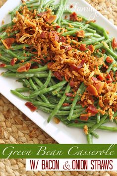 green bean casserole with bacon and onion straws on a white plate