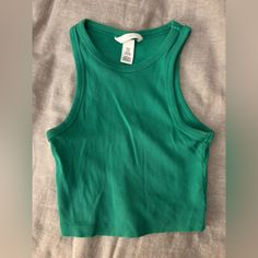 H&M Never Worn Green Tank Top H&m Green Tops For Spring, Trendy Sleeveless H&m Tank Top, H&m Trendy Spring Tank Top, Trendy H&m Spring Tank Top, Trendy H&m Tank Top For Spring, H&m Sleeveless Crop Top Casual, H&m Sleeveless Casual Crop Top, Casual Sleeveless Crop Top From H&m, Casual Sleeveless H&m Crop Top