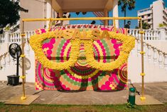 there is a large display in front of a building that has been decorated with flowers