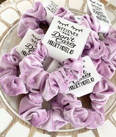 purple scrunffles with labels on them sitting on a plate