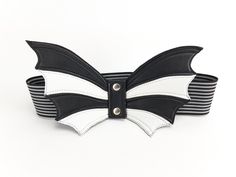 "This wide waist belt is made of thick elastic band in black and white stripes. Tape width 2.5 inches (6 cm). The belt is decorated with wings of black and white genuine leather and fastens with metal snaps. Thanks to the special material, the wings are flexible and hold their shape well. This unique belt you can wear as you like! Wings can be in front, side and even behind! This belt can be combined with any clothing. Add this fashionable item to your wardrobe and you will not leave anyone indi Leather Wings, Wide Waist Belt, Leather Peplum, Statement Belt, Womens Leather Belt, Obi Belt, Corset Belt, Wrap Belt, Branded Belts