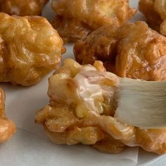 a white plate topped with donuts covered in icing