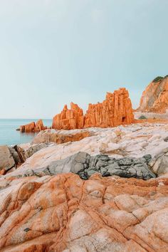 some rocks and water on a sunny day