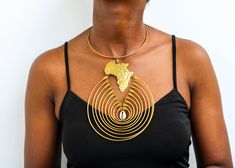 African Brass necklace, Brass jewelry, African jewelry for women, Tribal necklace, One size fits all, Christmas Gift for her, Moms gift The necklace is handcrafted using brass metal. Length: 9 inches Shipping fee is for the first item only, additional items ship for FREE. DHL Express shipping with 3-5 days delivery. To view our brass collection, click here: https://www.etsy.com/shop/NkoroiCrafts?ref=simple-shop-header-name&listing_id=1295061994&section_id=39639351 *Care instructions* Brass tarnishes with exposure to moisture and oxidation. To clean it, kindly use a lemon wedge. Squeeze the juice and polish along the surface with a clean cloth. Unique Clavicle Chain Choker For Gift, Unique Pendant Choker As Gift, Unique Choker Necklace As Gift, Unique Choker Necklace For Gift, Metal Drop Choker Necklace As Gift, Unique Choker Jewelry For Gifts, Unique Choker Style Jewelry Gift, Round Brass Choker For Gift, Round Brass Choker Gift